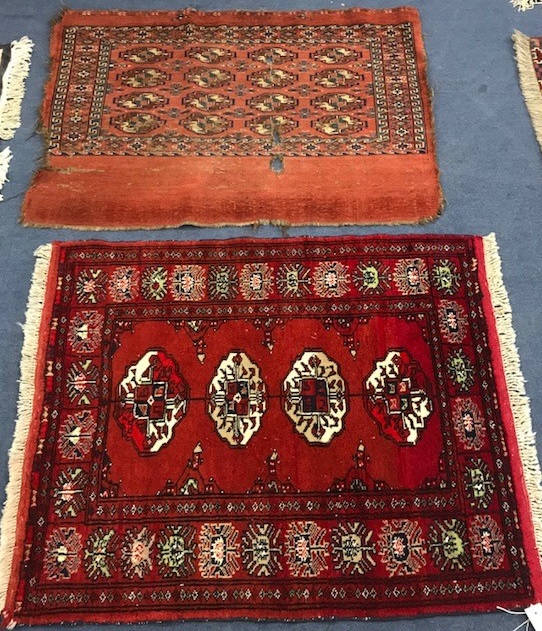 A small red ground mat and another 109cm x 78cm, 103cm x89cm